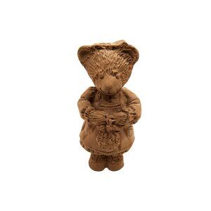 vintage hand crafted solid resin brown bear with a basket figurine.